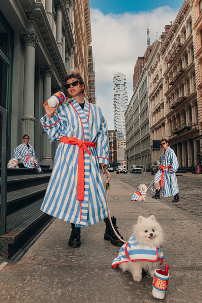 woman and dog in matching robes