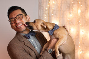 dog licking humans face