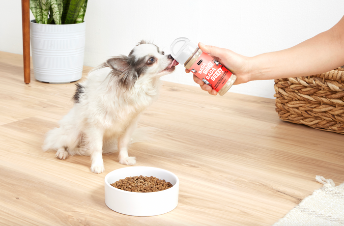 dog licking food topper