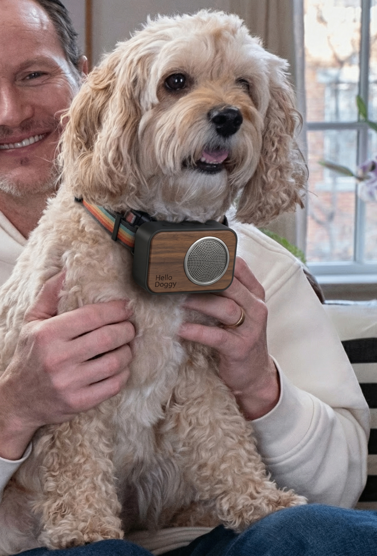 Patrick Wilson holding Eddie the dog with Hello Doggy speaker